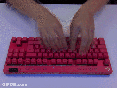 A Person Is Typing On A Red Keyboard That Has The Ctrl Key GIF