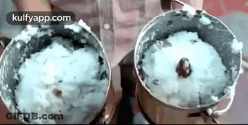A Person Is Using A Blender To Make A Rice Dish . GIF