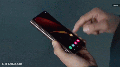 A Person Is Using A Samsung Phone In Their Hands GIF