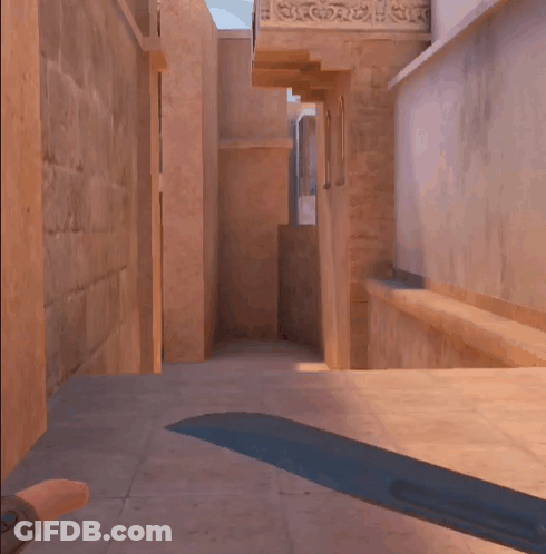 A Person Is Walking Down A Hallway With A Sword In The Foreground GIF