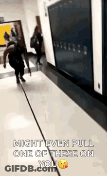 A Person Is Walking Down A Hallway With The Words `` Might Even Pull One Of These On You '' On The Bottom . GIF