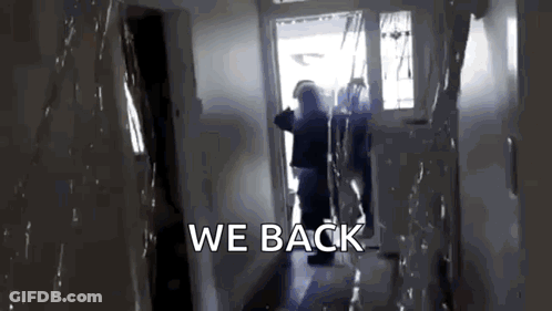 A Person Is Walking Down A Hallway With The Words We Back Written On The Bottom GIF