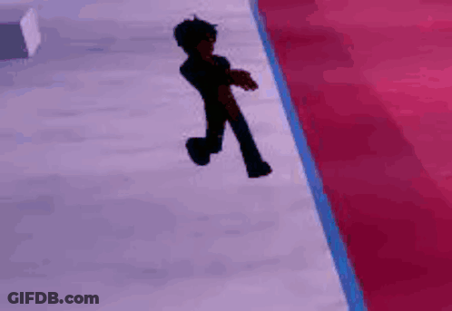 A Person Is Walking Down A Red Carpet On A Ice Rink . GIF