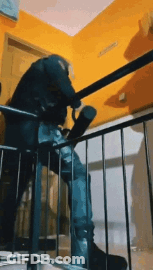 A Person Is Walking Down A Set Of Stairs With A Umbrella . GIF