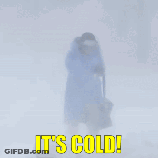 A Person Is Walking In The Snow With The Words It 'S Cold GIF
