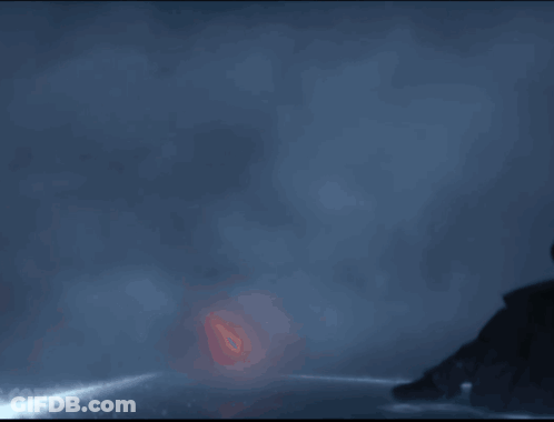 A Person Is Walking Through A Tunnel Of Fire GIF