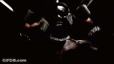 A Person Is Wearing A Bracelet On Their Wrist In A Dark Room GIF