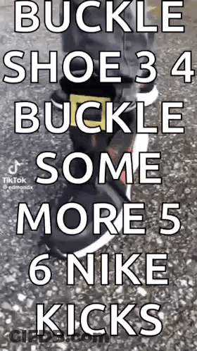 A Person Is Wearing A Pair Of Nike Shoes With A Buckle On The Side . GIF
