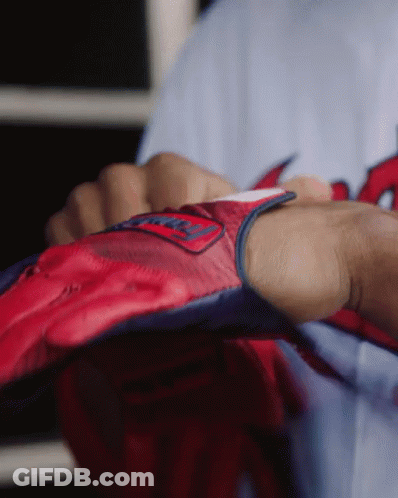 A Person Is Wearing A Red And Blue Glove With The Word Washington On It GIF