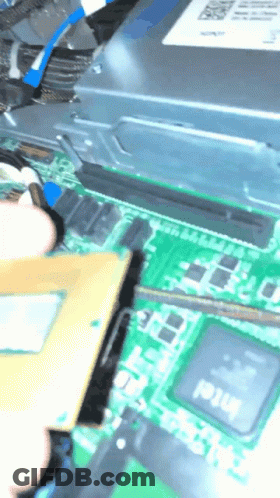 A Person Is Working On A Motherboard That Has An Intel Processor On It GIF