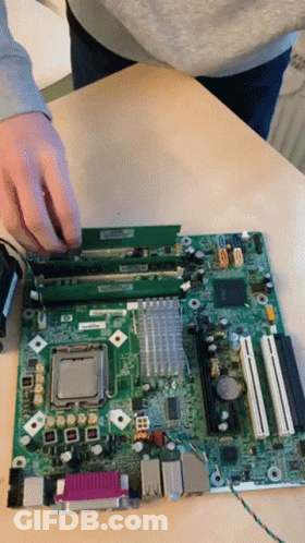 A Person Is Working On A Motherboard That Says Hp GIF
