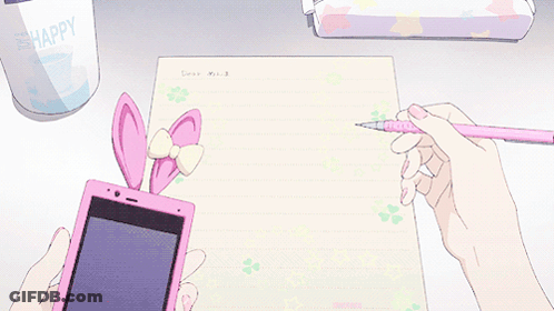 A Person Is Writing On A Piece Of Paper While Holding A Cell Phone GIF