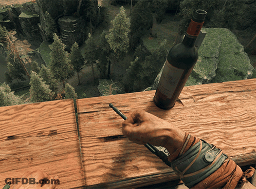 A Person Is Writing On A Piece Of Wood Next To A Bottle Of Wine That Says Chateau GIF