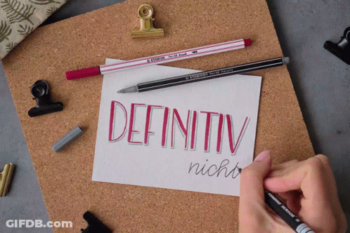 A Person Is Writing The Word Definitiv In Red On A Piece Of Paper GIF