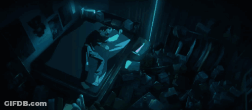 A Person Laying In A Dark Room With A Blue Light Shining On Them GIF