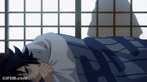 A Person Laying On A Bed With A Blue Blanket That Says H GIF
