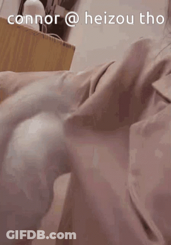 A Person Laying On A Bed With The Words Connor @ Heizou Tho Written On The Top GIF