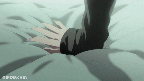 A Person Laying On A Bed With Their Hand On A Pillow GIF