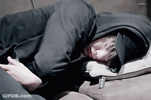 A Person Laying On A Couch With The Word Laundry On The Bottom Left GIF