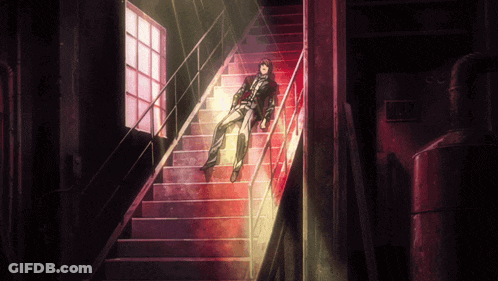 A Person Laying On A Set Of Stairs With A Sign That Says No Smoking GIF