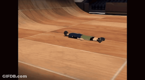 A Person Laying On Their Back On A Skateboard GIF