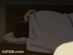 A Person Laying On Their Back With Their Head On A Pillow In The Dark GIF
