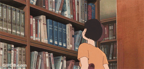 A Person Looking At Books On A Shelf With One That Says ' Chinese ' On The Front GIF
