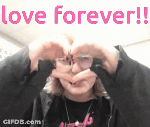 A Person Making A Heart Shape With Their Hands With The Words Love Forever Written Above Them GIF