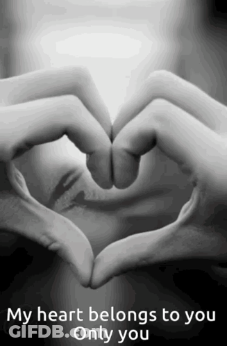 A Person Making A Heart Shape With Their Hands With The Words " My Heart Belongs To You Only You " GIF