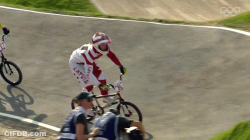 A Person On A Bike With The Word Latvia On Their Pants GIF