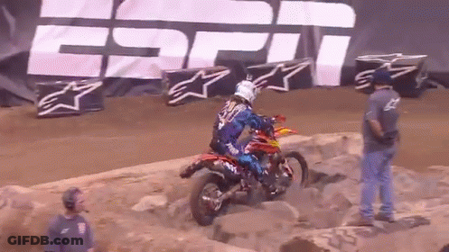 A Person On A Dirt Bike In Front Of A Espn Sign GIF