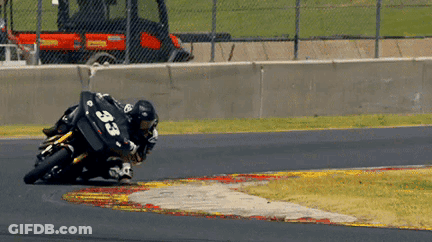 A Person On A Motorcycle With The Number 33 On Their Back GIF