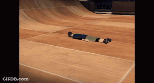 A Person On A Skateboard Laying On The Floor GIF