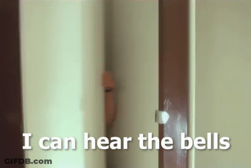 A Person Peeking Out From Behind A Door With The Words I Can Hear The Bells Below Them GIF