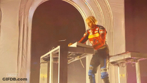 A Person Playing A Keyboard With The Word Catchella On The Bottom Right GIF