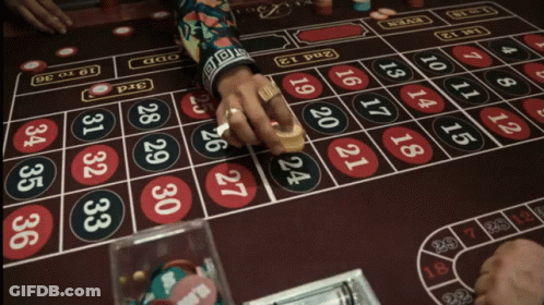 A Person Playing Roulette With The Words " I 'Ll Take That Bet " Below GIF
