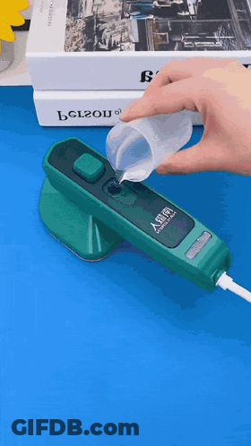 A Person Pouring Liquid Into A Green Device That Says Belzou On The Front GIF