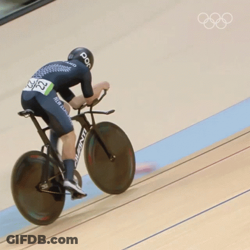 A Person Riding A Bicycle With The Number 22 On Their Back GIF