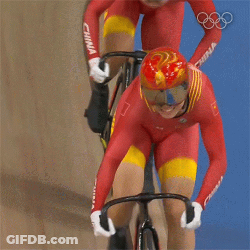 A Person Riding A Bike With A Helmet That Has A Bird On It GIF
