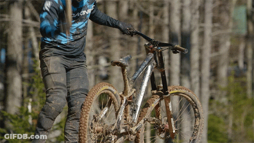 A Person Riding A Bike With A Shirt That Says Dakine GIF