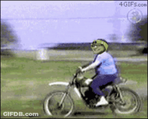 A Person Riding A Dirt Bike With A 4Gifs.com Logo On The Bottom Right GIF