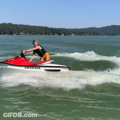 A Person Riding A Honda Jet Ski In The Water GIF