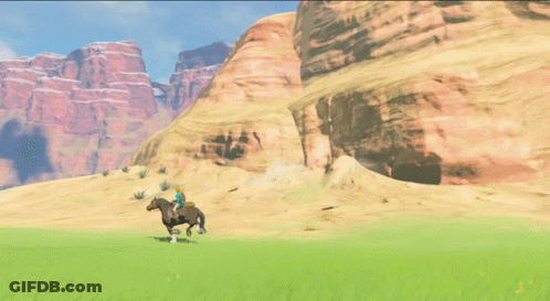 A Person Riding A Horse In A Desert With Mountains In The Background GIF