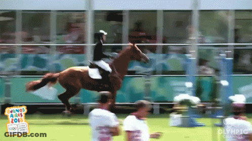 A Person Riding A Horse With A Sign That Says Olympic Channel GIF