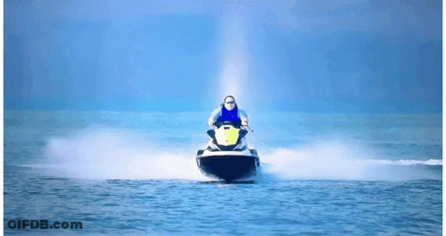 A Person Riding A Jet Ski With A Yellow Sticker On The Front GIF