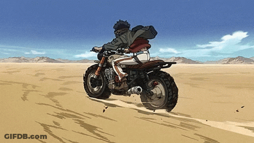 A Person Riding A Motorcycle In The Desert With Mountains In The Background GIF