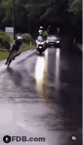 Person Riding Motorcycle On Wet Road GIF