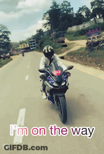 A Person Riding A Motorcycle With The Words I 'M On The Way GIF
