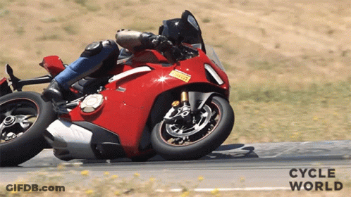 A Person Riding A Red Motorcycle On A Road With Cycle World Written On The Bottom Right GIF