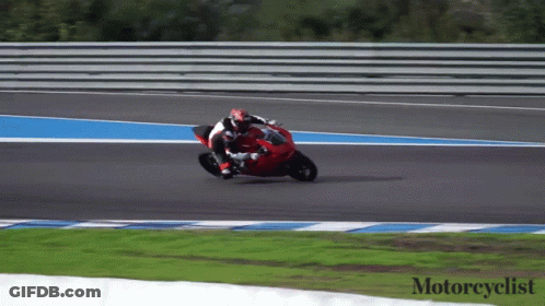 A Person Riding A Red Motorcycle On A Track With The Words Motorcyclist Below Them GIF